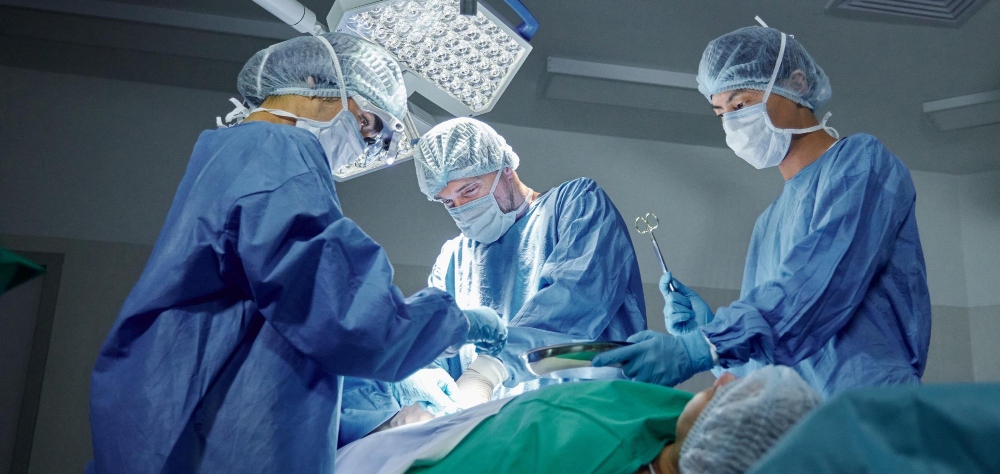 Surgeon performing total knee replacement surgery in a modern operation theatre in India